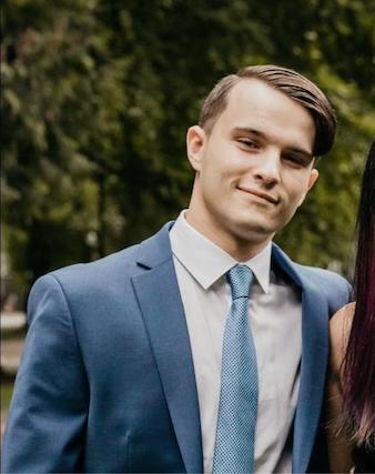 Neo-Nazi Zachary Lambert, pictured in a blue suit at his wedding.