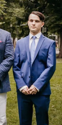 Neo-Nazi Zachary Lambert, pictured in a blue suit at his wedding.