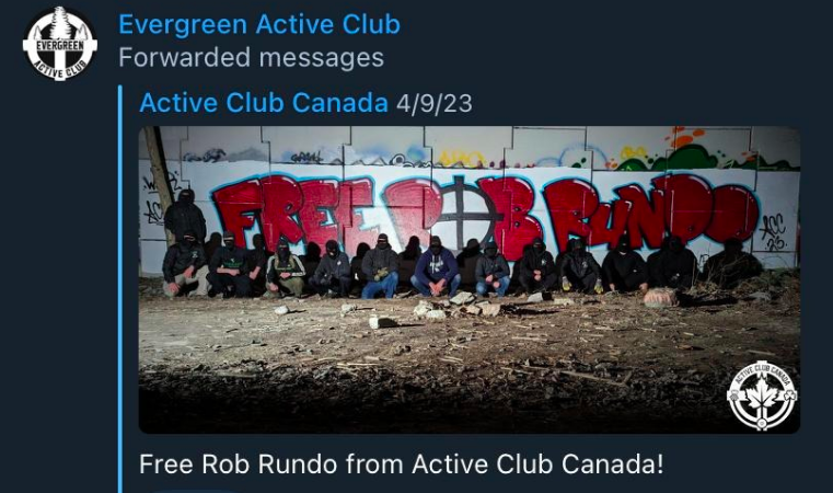 telegram post on the evergreen active club channel. its a crosspost from "active club canada", pic of graffiti the reads "free rundo" with a bunch of masked nazis in front of it. caption reads "free rob rundo from active club canada!"