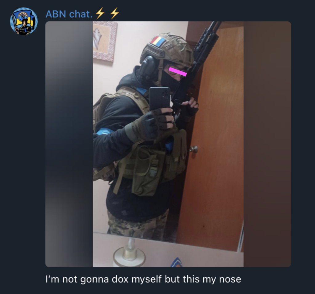 Photo AP posted of himself to ABN chat Telegram. Caption reads " not gonna dox myself but this is my nose", and the pic is him in military gear with a romanian flag patch on his helmet. he is holding a rifle.