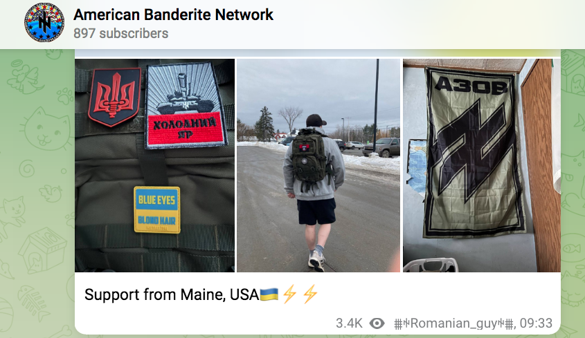 A screenshot of a post on the American Band Network telegram chat. It shows a man in shorts and wearing a backpack walking away from the camera down a snow-lined road. On either side of him are white nationalist flags and patches.